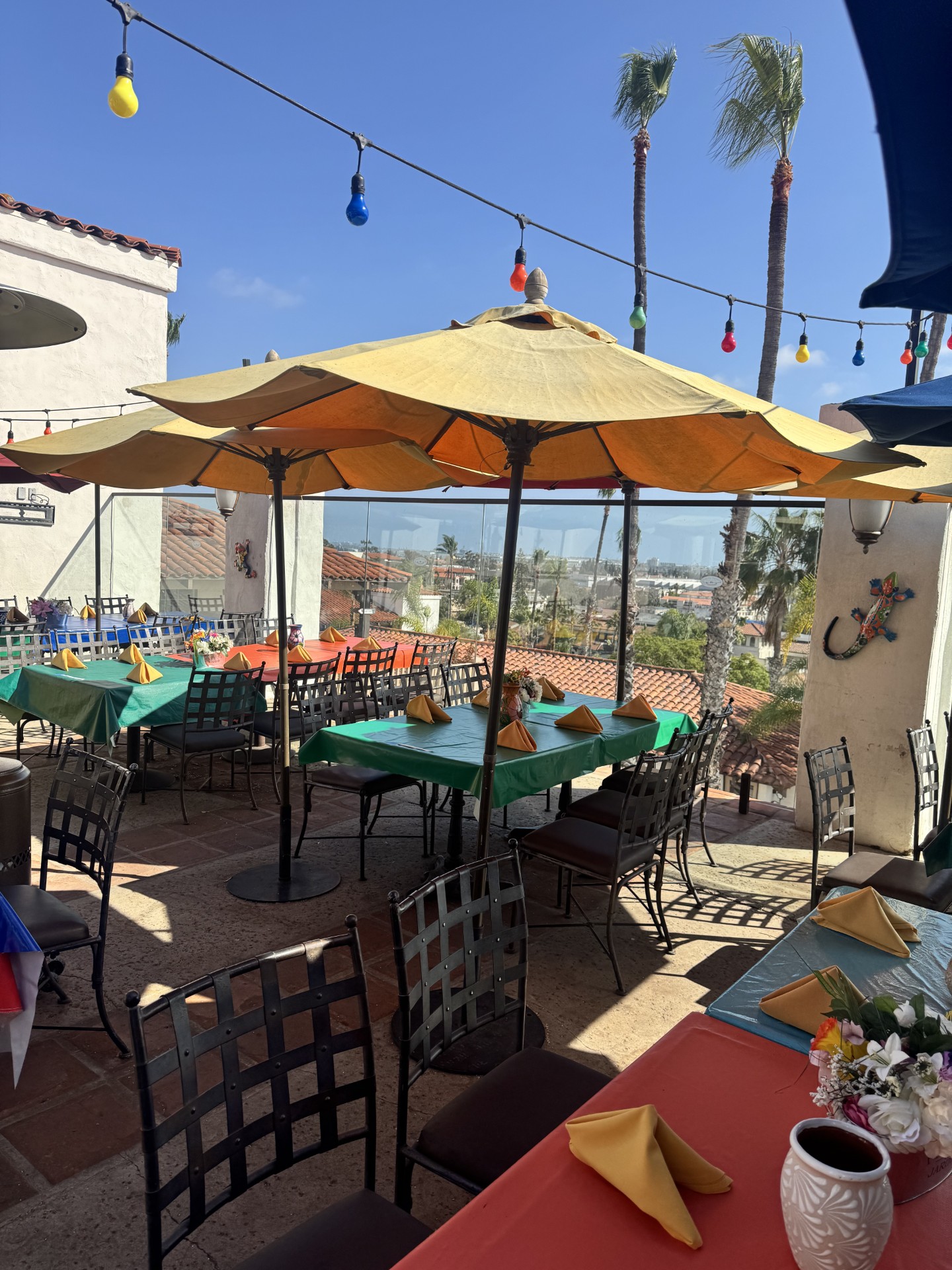 Bright OTTF patio with yellow umbrellas